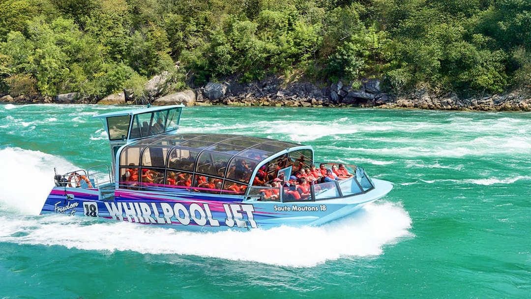 Guests enjoying the Freedom jet boat tour on the Niagara River Gorge, Niagara, Canada.