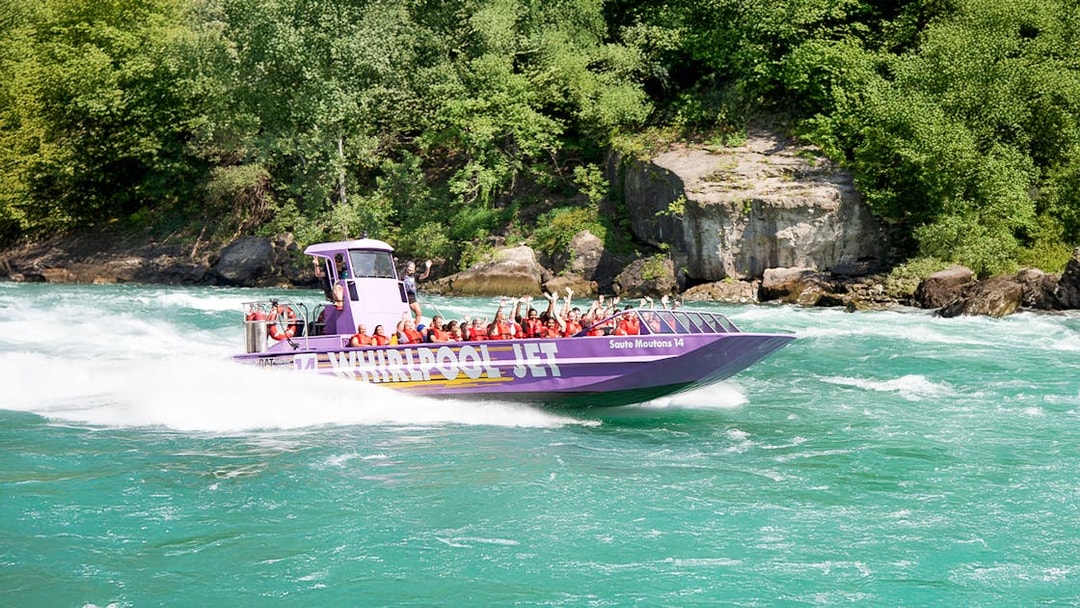 Guests enjoying Whirlpool Jet Boat Tour in Niagara Gorge, Canada.