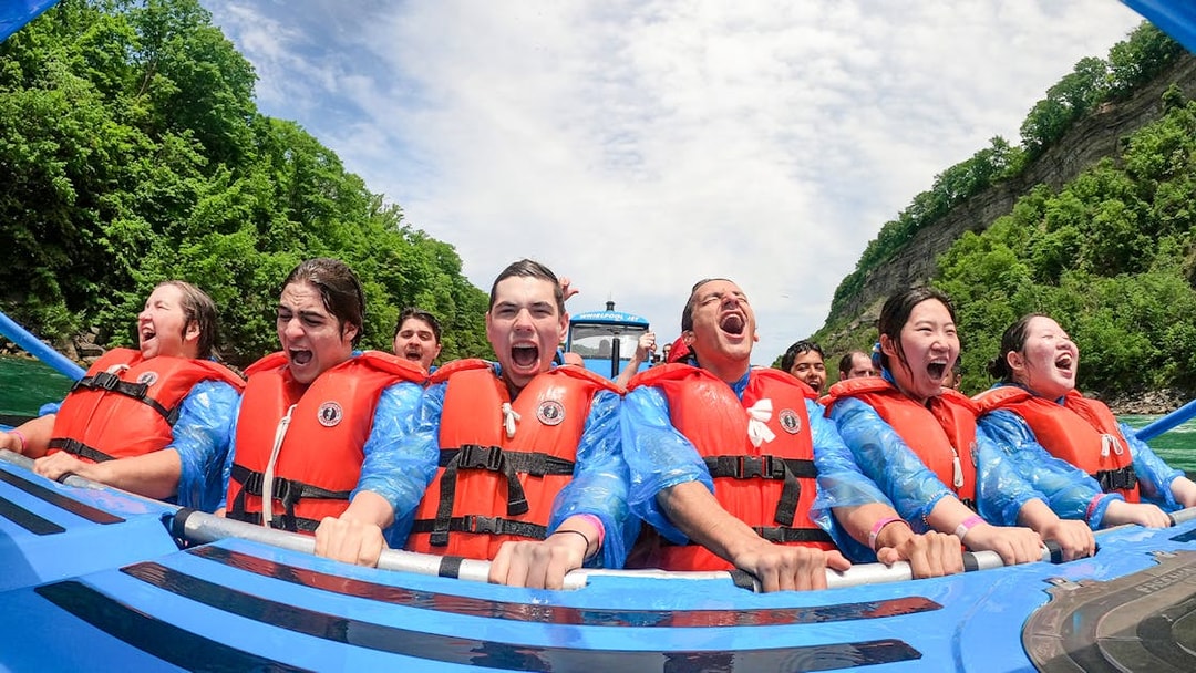Guests enjoying a thrilling Whirlpool Jet Boat Tour in Niagara Gorge, Canada.