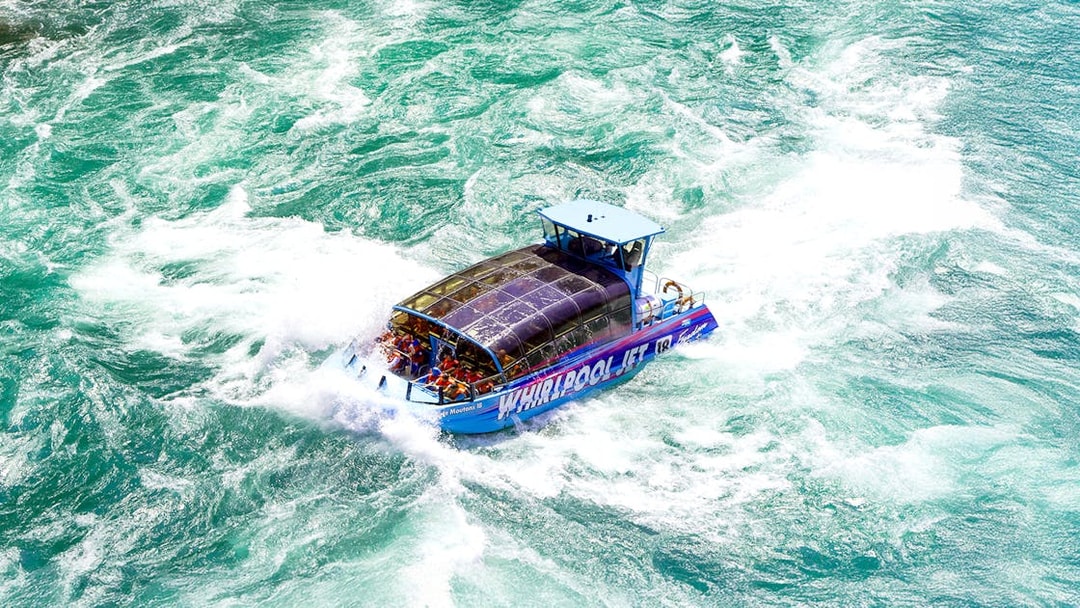 Guests enjoying the Freedom jet boat tour on the Niagara River Gorge, Niagara, Canada.