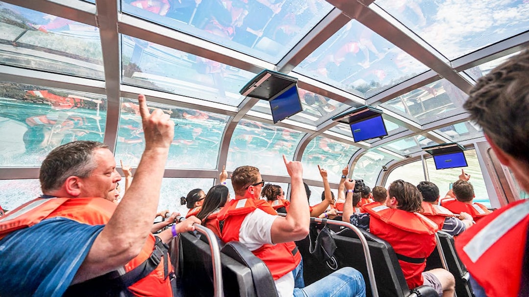Guests enjoying the Freedom jet boat tour in the Niagara River Gorge, Canada.