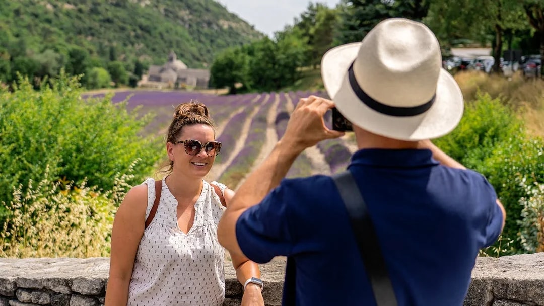 Person posing for a photo in front of lavender fields in Luberon during a morning tour.