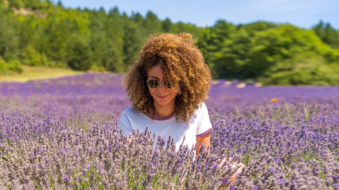 Woman enjoying lavender field in Sault, France.