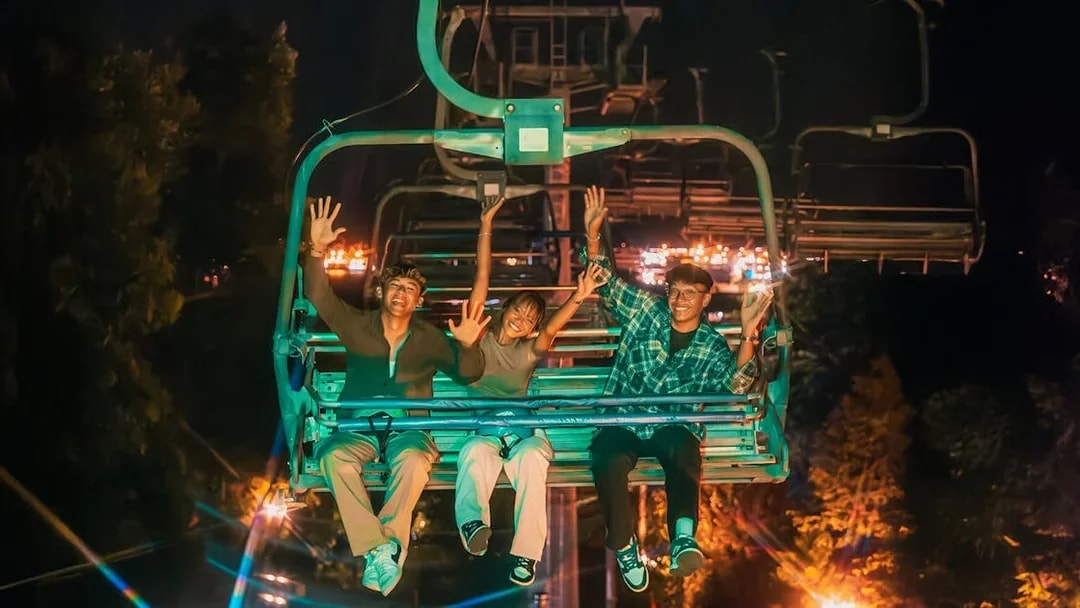 Friends enjoying the Skyride at night in Singapore.