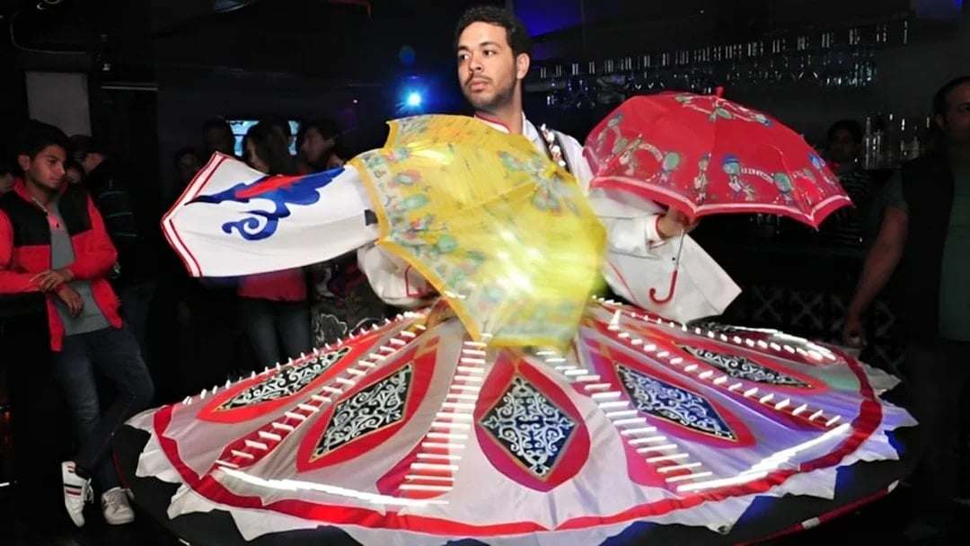 Dancer performing traditional Tanoura dance on Nile River dinner cruise.