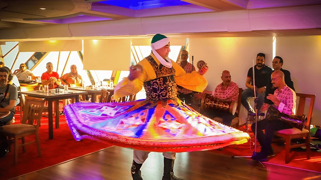 Dancer performing traditional Tanoura on Nile River dinner cruise in Cairo.