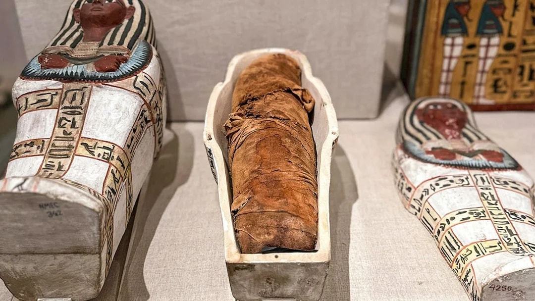 Mummy and sarcophagi at the National Museum of Egyptian Civilization in Cairo.