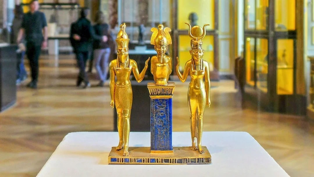 Golden Egyptian statues on display at the National Museum of Egyptian Civilization in Cairo.