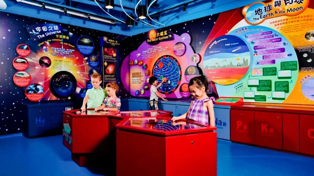 Children exploring interactive exhibits at Noah's Ark Hong Kong science center.