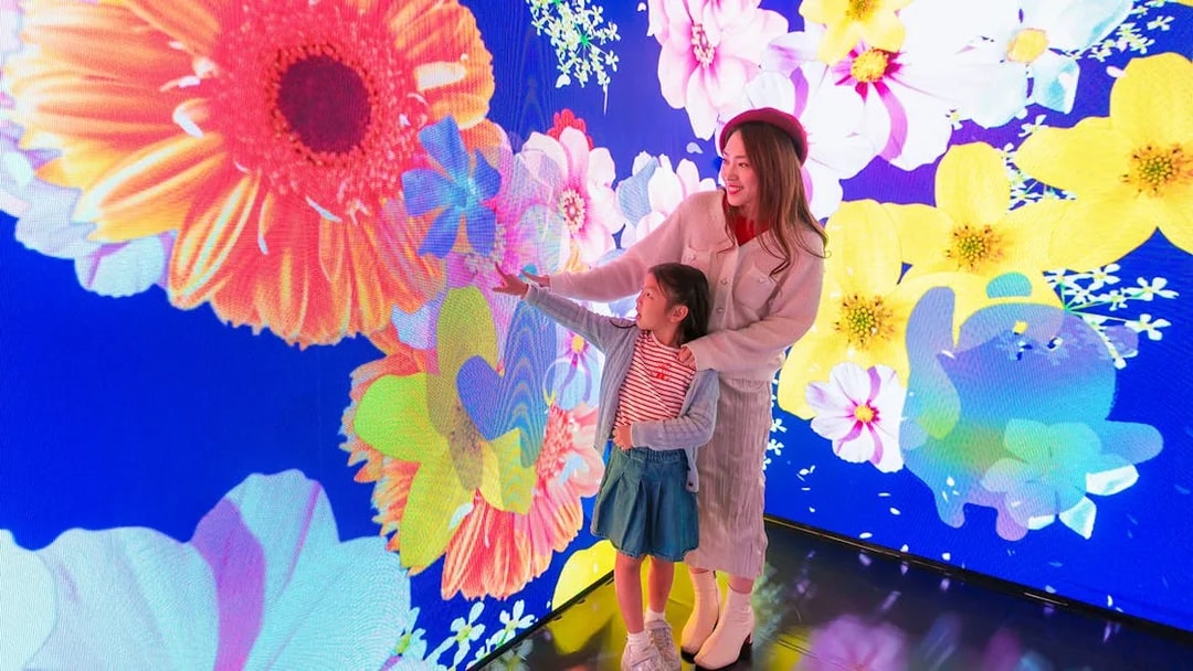 Visitors enjoying digital floral display at Ocean Park Hong Kong.