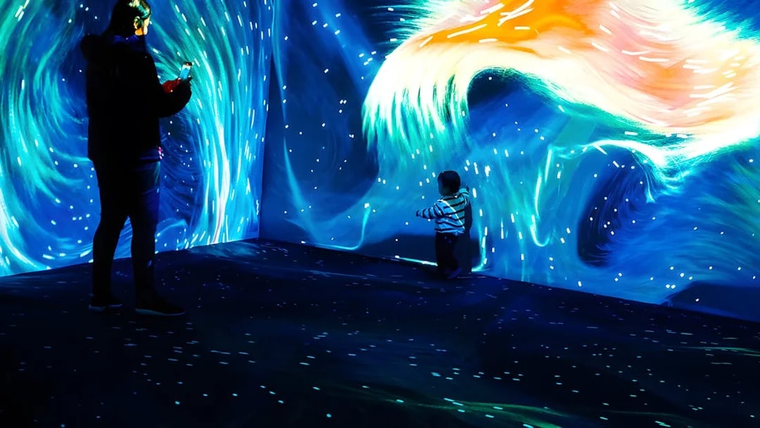 Father and child exploring Lisbon Oceanarium's Submerged Universe exhibit.