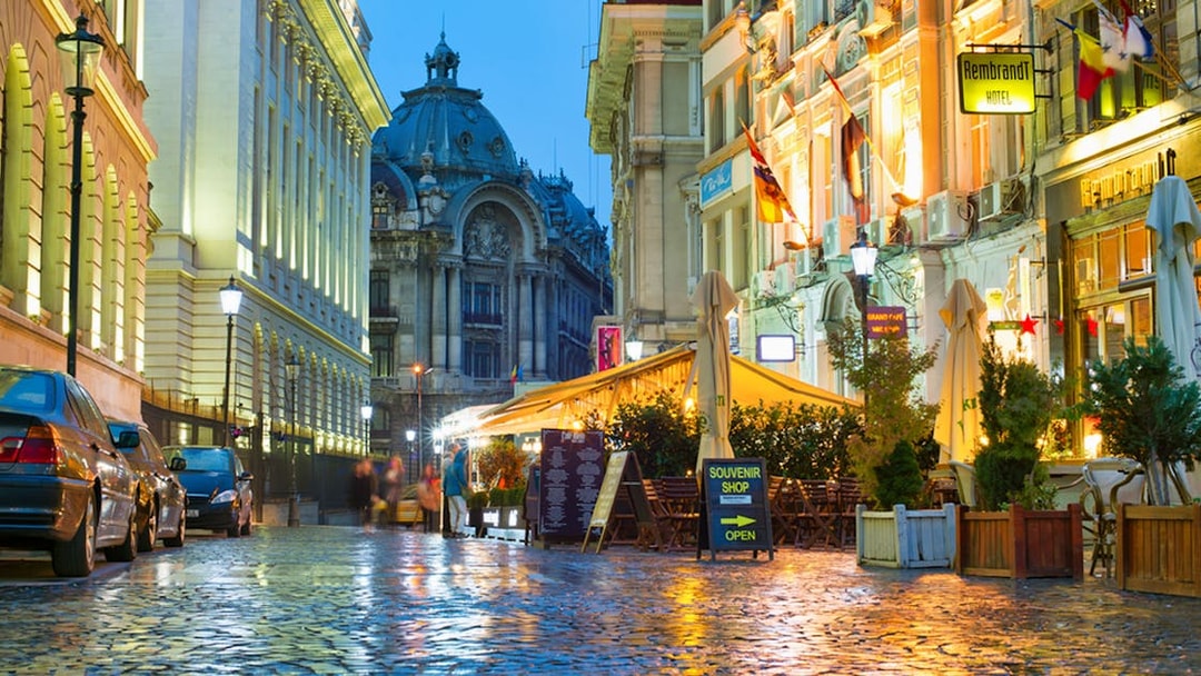 Old Town Bucharest street with cafes and historic architecture during a walking food tour.