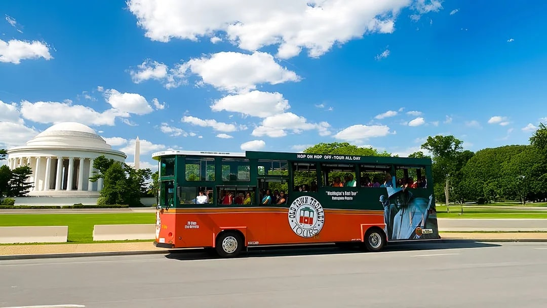 Tour bus near Jefferson Memorial and Washington Monument, Washington DC.