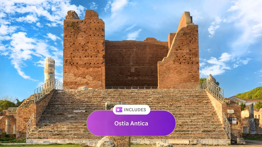 Ancient Roman theater ruins at Ostia Antica under a blue sky.