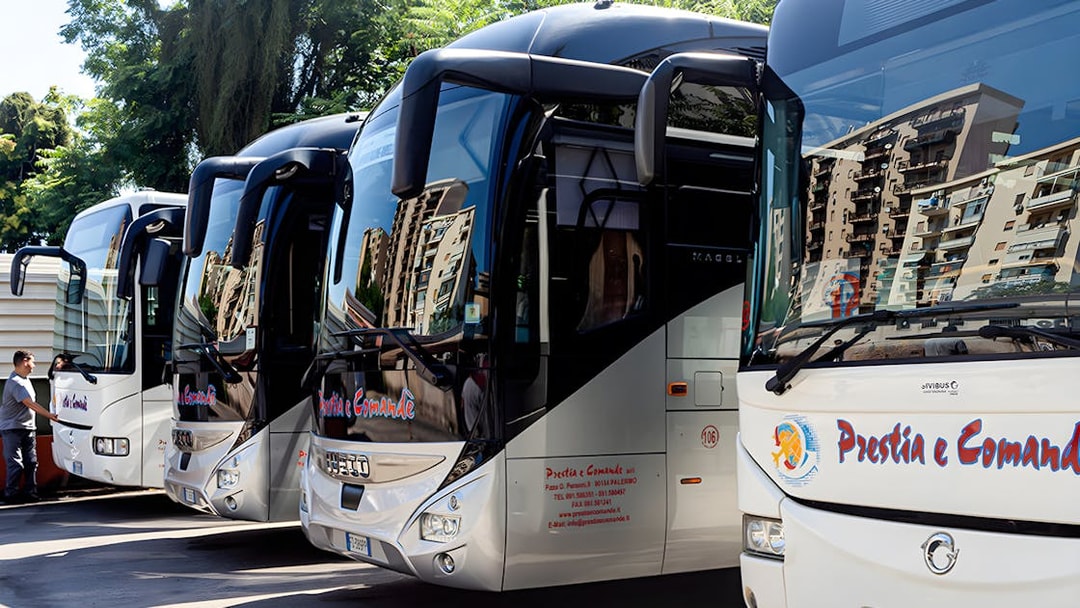 Prestia and Comandè buses parked in Palermo lot.