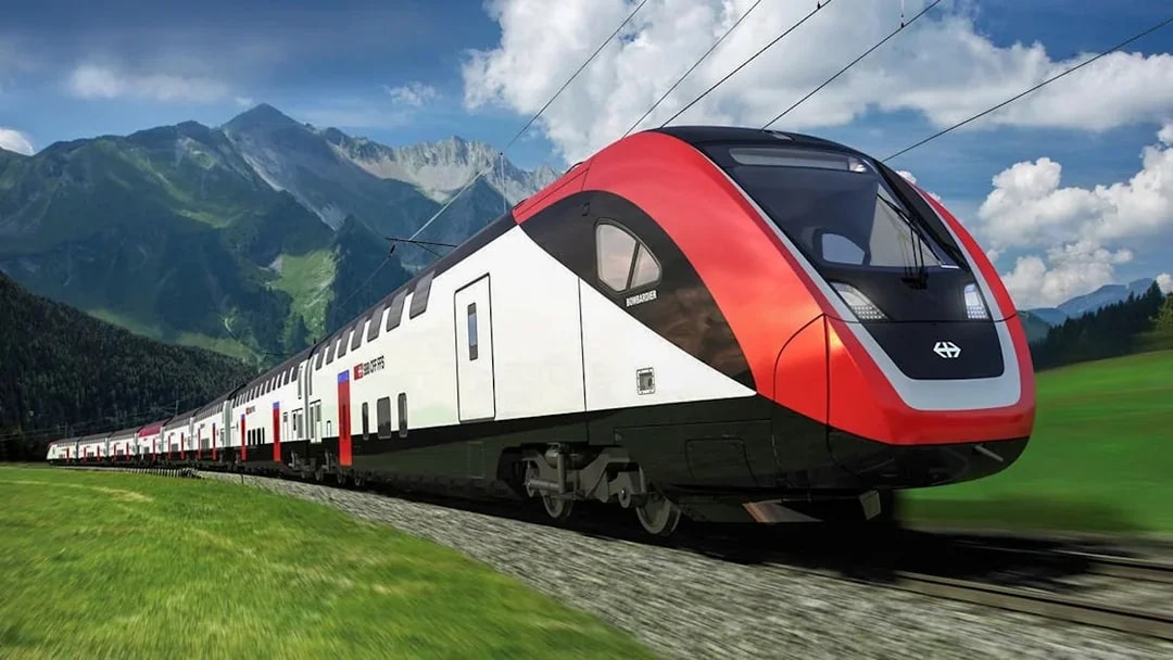 Train traveling from Zurich Airport to Zurich Central with mountains in the background.