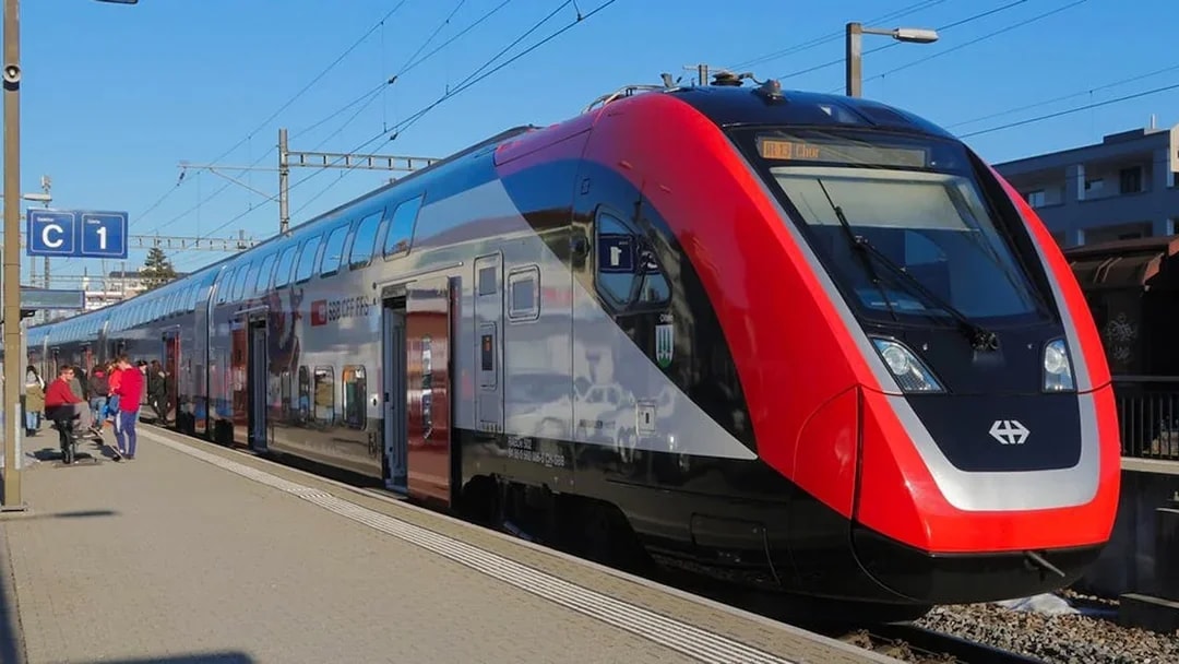 Train at Zurich central station platform for airport transfer.