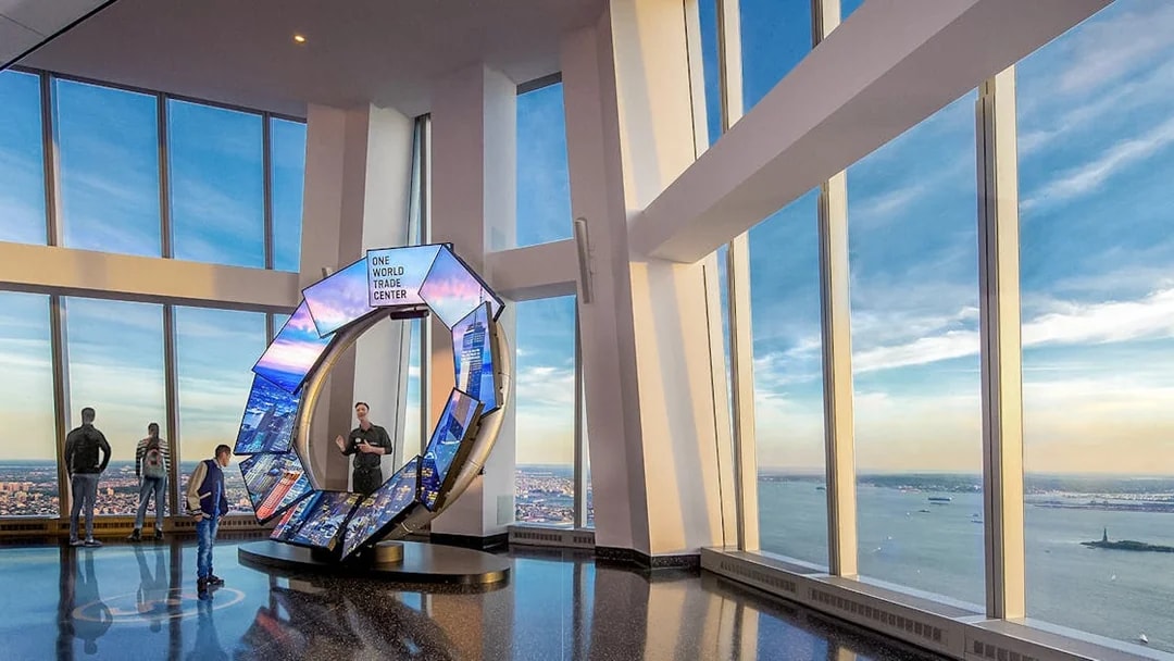 One World Observatory view of New York City skyline with City Pulse exhibit.