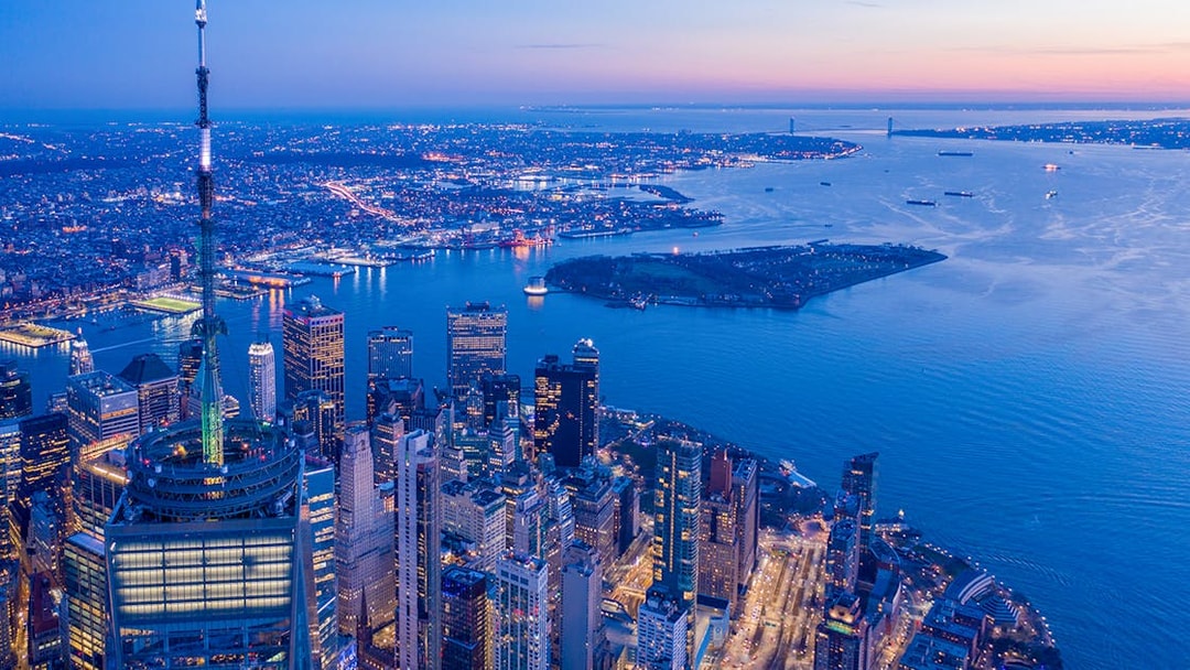 Aerial view of New York City skyline from One World Observatory at dusk.