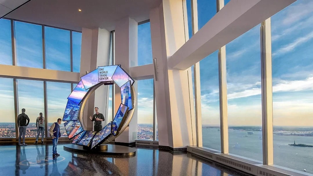 One World Observatory view of New York City skyline with City Pulse exhibit.