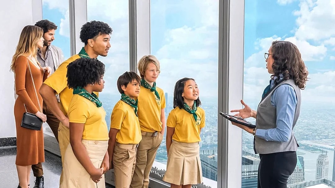 Group on One World Observatory VIP Tour overlooking New York City skyline.