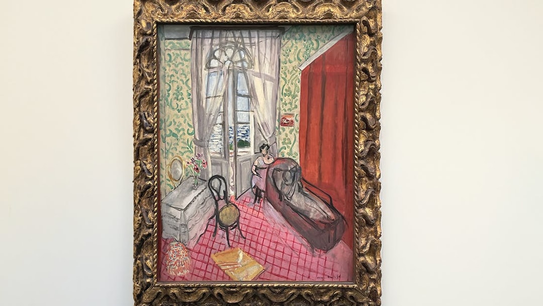 Boudoir painting at Orangerie Museum, Paris, featuring a woman by a window.