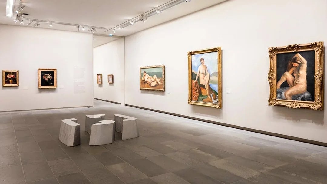 Paintings displayed inside Orangerie Museum gallery room.