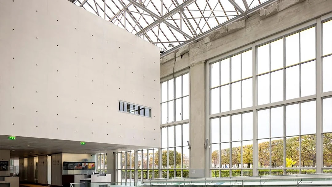 Orangerie Museum interior with large windows and modern architecture.
