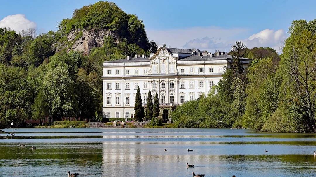 Leopoldskron Palace by a lake in Salzburg, featured in the Original Sound of Music Tour.
