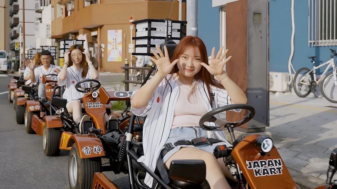 People driving go-karts on an Osaka street during a 90-minute tour.