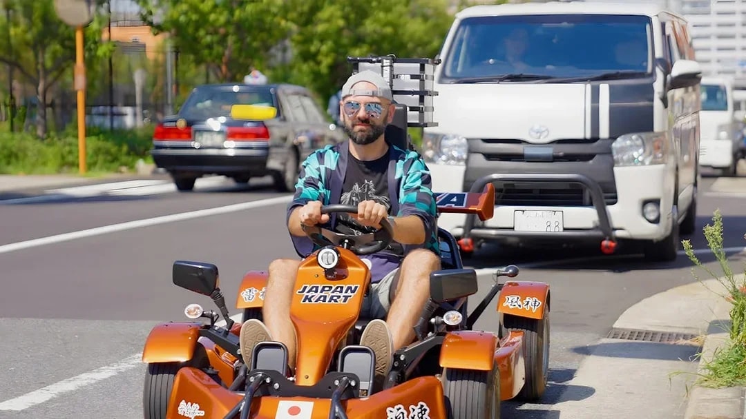 Man driving a gokart on street, Osaka tour 90min experience.