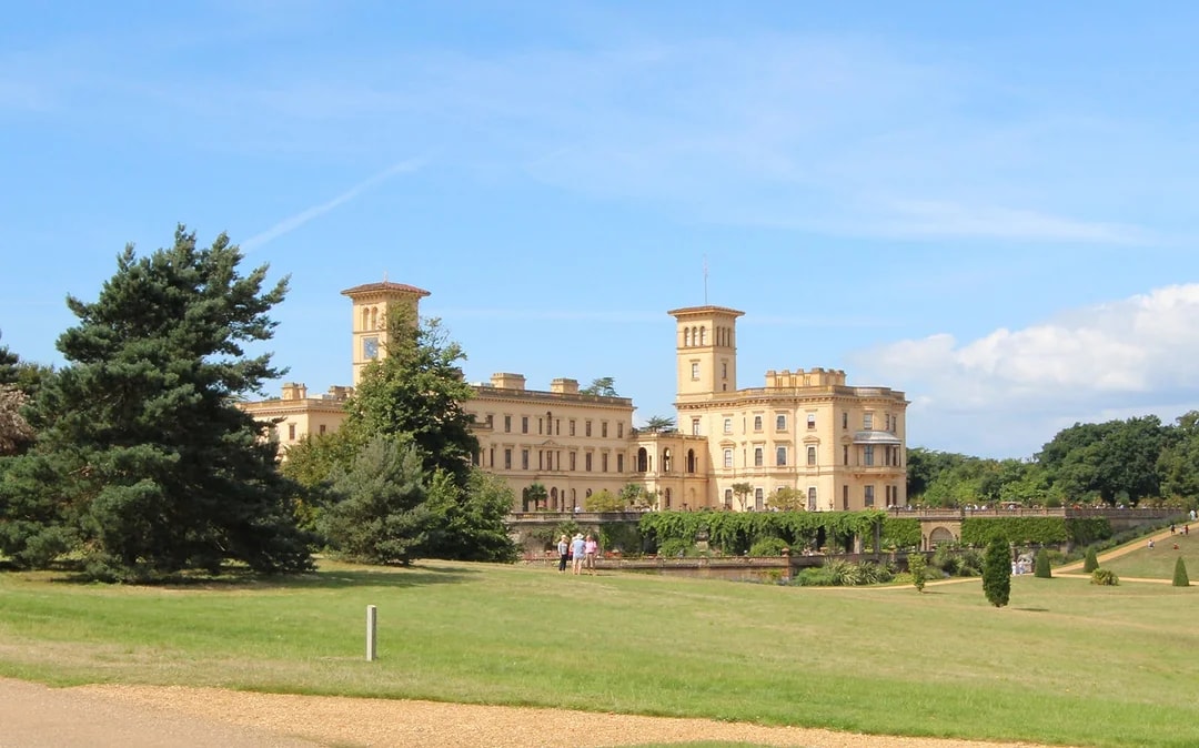 Osborne House with gardens and visitors on a sunny day, Isle of Wight.