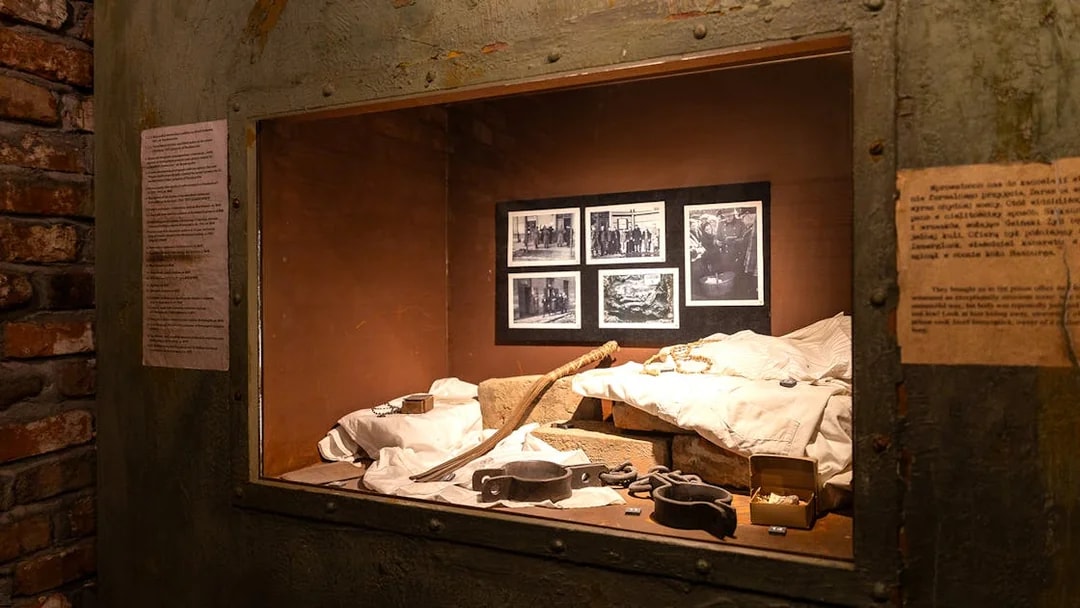 Artifacts and photos displayed inside Oskar Schindler's Factory exhibit in Krakow.