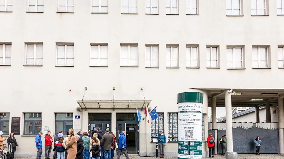 Oskar Schindler's Factory exterior with visitors in Krakow, Poland.
