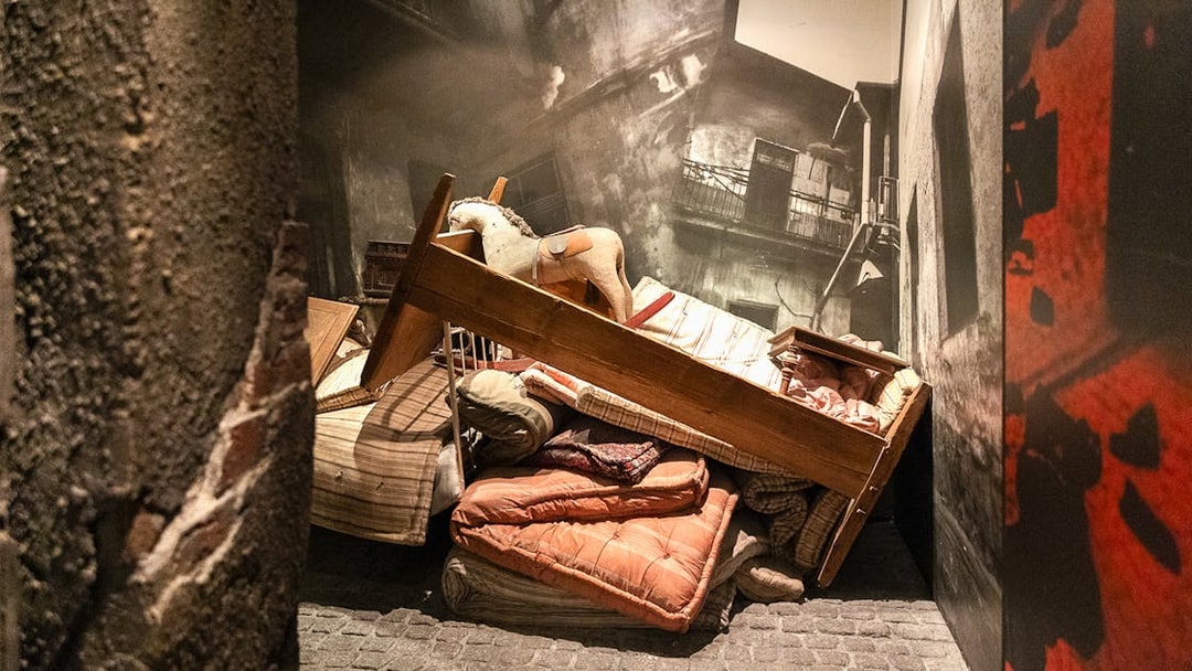 Piled furniture and belongings in the Liquidation exhibit at Oskar Schindler's Factory.