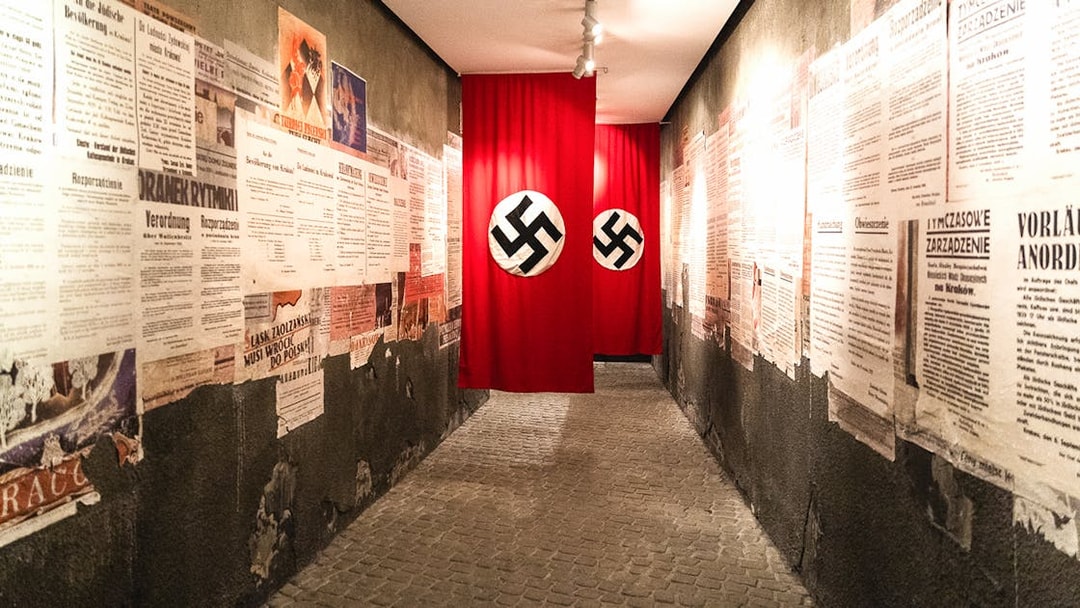 Hallway with historical posters and Nazi flags inside Oskar Schindler's Factory, Krakow.