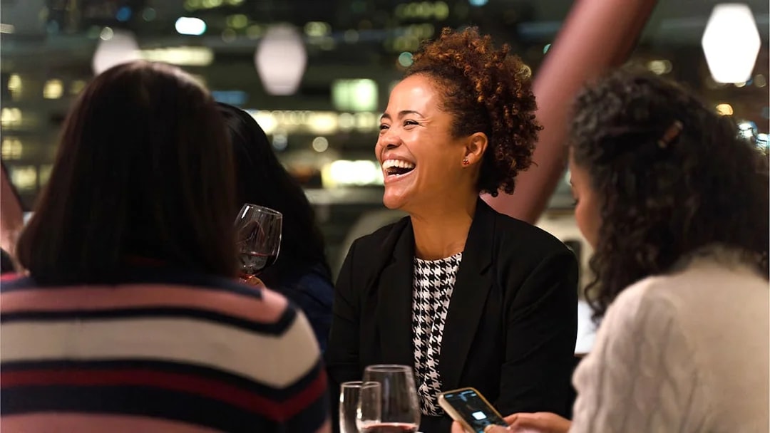 Guests enjoying a meal on an Oslo dinner cruise.