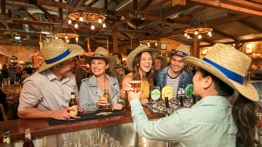 Guests enjoying drinks at the Australian Outback Spectacular Heartland Dinner & Show bar.