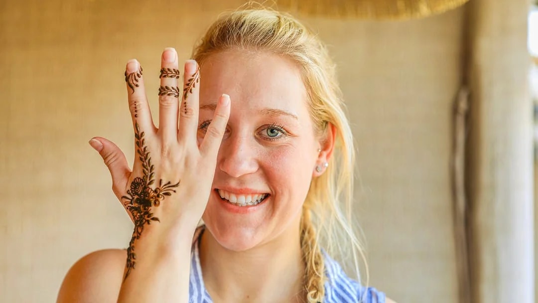 Henna design on hand during Bedouin Desert Safari experience.