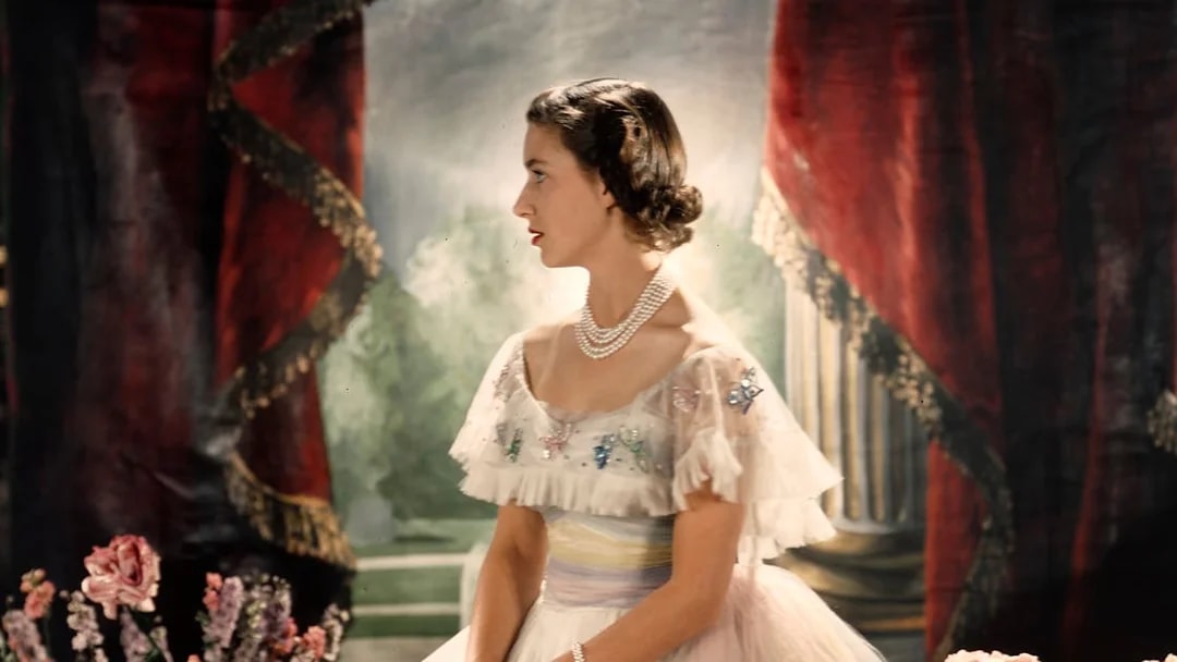 Royal figure in elegant attire at the King's Gallery, Palace of Holyroodhouse.