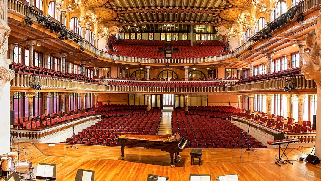 Palau de la Musica Catalana interior with ornate balconies and stage in Barcelona.