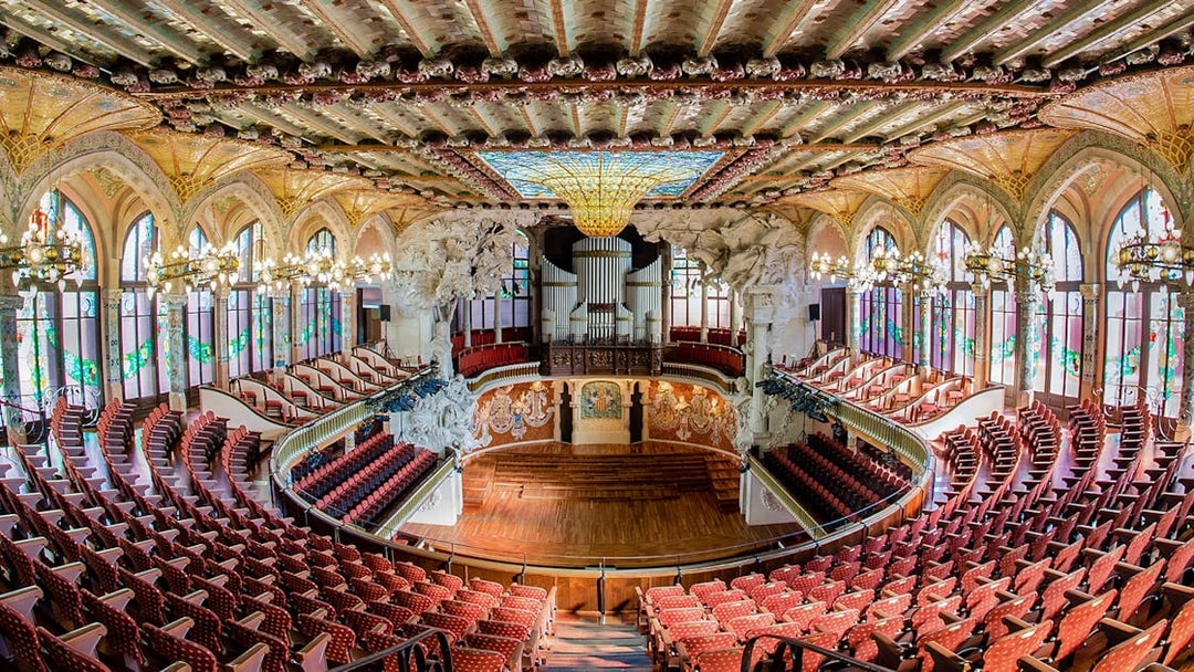 Concert Hall interior at Palau de la Música Catalana, Barcelona, featuring ornate architecture and seating.