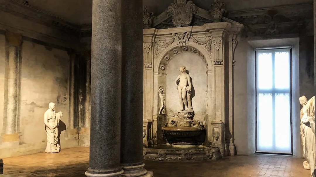 Statues and ornate fountain inside Palazzo Barberini, Rome.