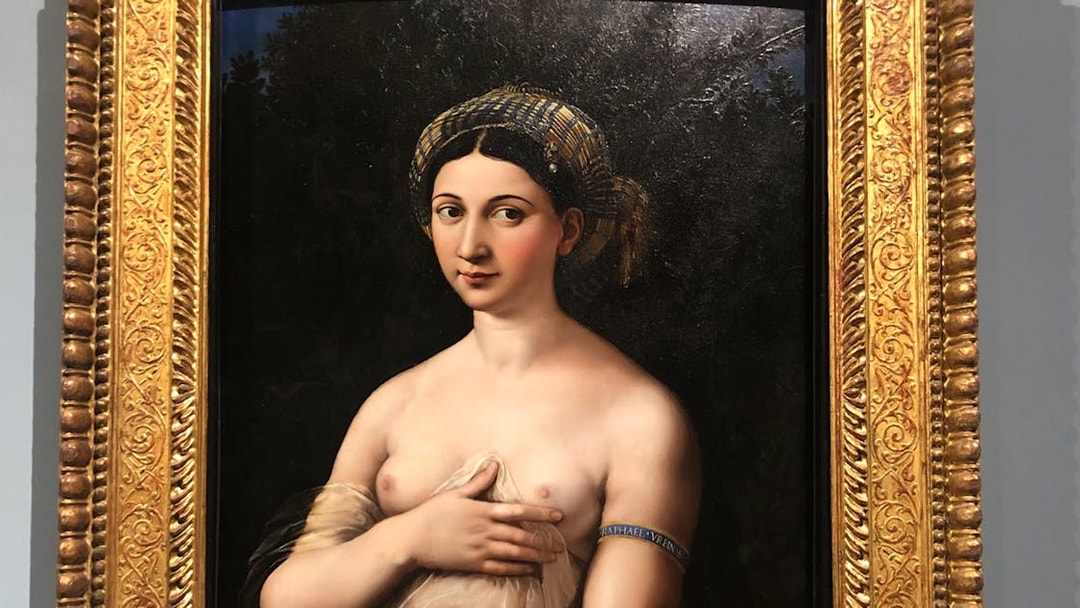 Raphael's "La Fornarina" portrait in ornate gold frame.
