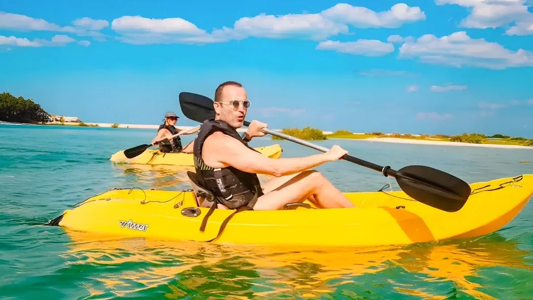 Man kayaking in clear waters at Atlantis, The Palm, Dubai.