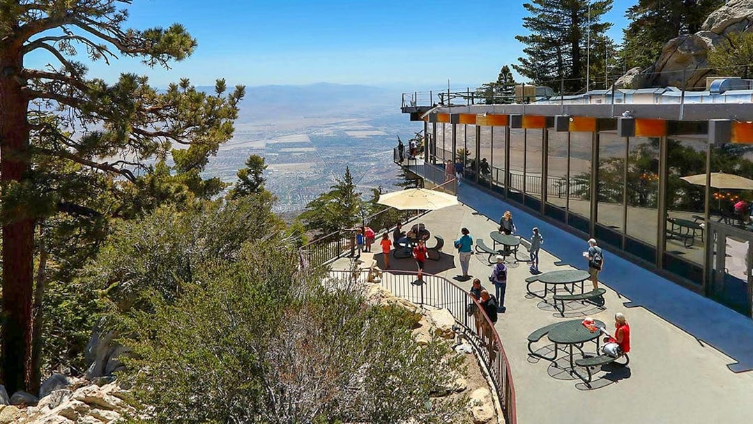 Visitors enjoying the view from the Palm Springs Aerial Tramway observation deck.
