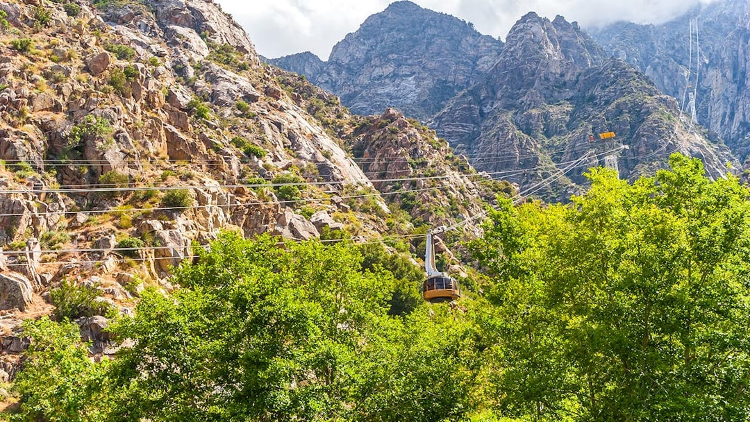 Tramway ascending rocky mountains at Palm Springs Aerial Tramway.