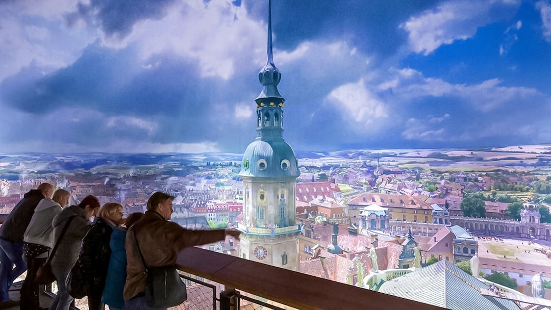 Visitors viewing panoramic cityscape at Panometer Dresden.