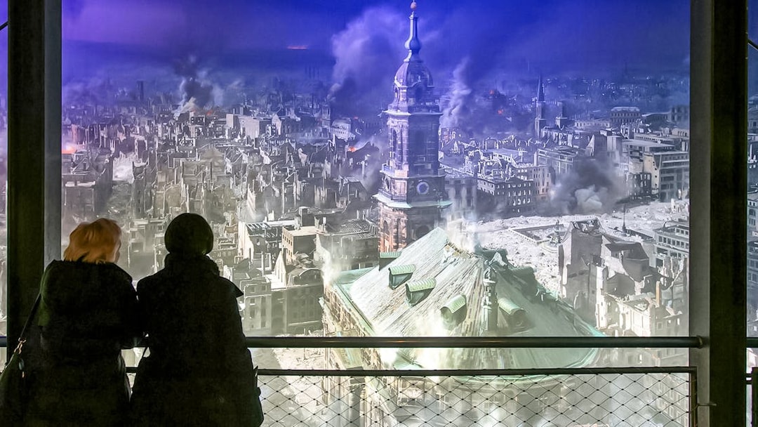 Visitors viewing Dresden cityscape panorama at Panometer Dresden.
