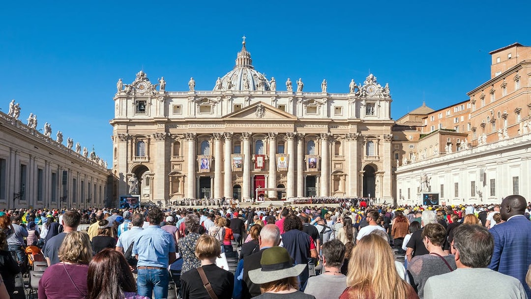 Tourists gathered at St. Peter's Basilica in Vatican City, Rome, Italy.